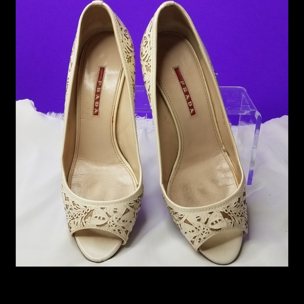 Prada Laser cut Cream Pumps